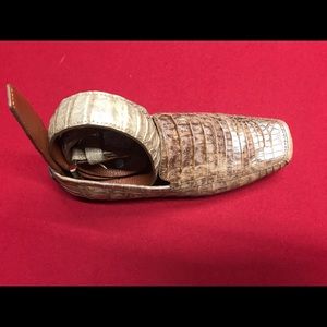 Men’s shoes and matching belts.